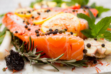 Fresh salmon fillets with spices ready for bakin