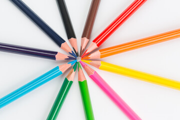 Colourful pencils on white background