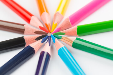 Colourful pencils on white background