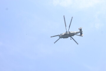 military rocket helicopter over the sea.