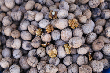 Walnuts with and without shells background of fresh walnuts.