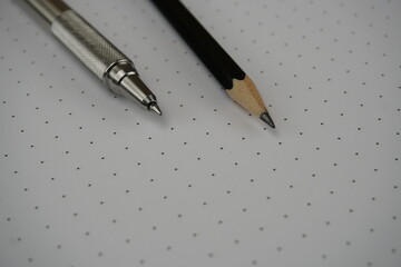 Dot grid notebook with pen and pencil - 420990408