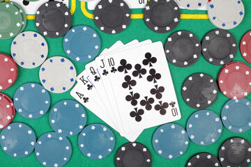 Poker chips cards table winning royal flush,  top view - obrazy, fototapety, plakaty