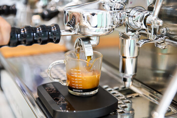 close-up brewing American coffee with a coffee machine.