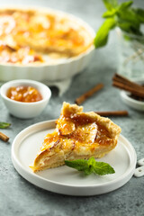 Traditional homemade apple tart with apricot jam