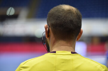 Detail with referee and earphone headset during a handball game