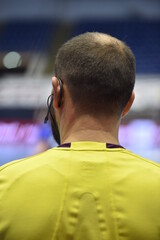 Detail with referee and earphone headset during a handball game