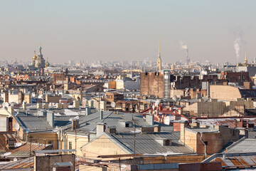 Sunny spring day in Saint Petersburg, Russia. View on the rooftops in the city center and a huge tower on the horizon.