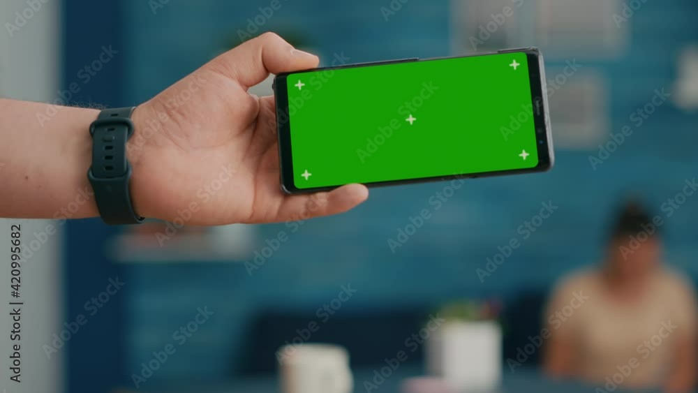 Poster front view of horizontal isolated mock up green screen chroma key display of modern phone. two colle