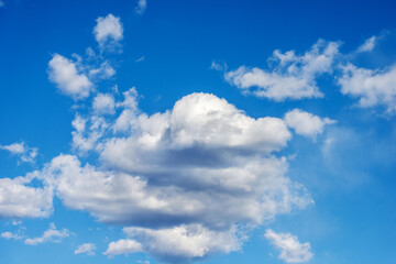 Obraz na płótnie Canvas Beautiful blue sky with white cumulus clouds (cumulonimbus), full frame, photography.