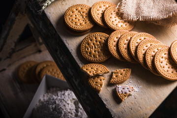 Closeup shot of tasty cookies on a rusty surface on a black background