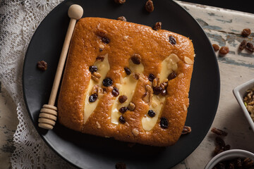 Closeup shot of a tasty biscuit with ingredients on the side