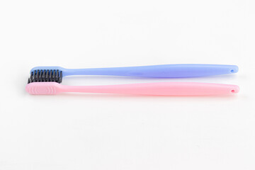Colorful toothbrushes on a white background. Close-up. Soft Focus
