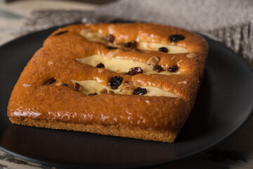 Closeup shot of a tasty biscuit with ingredients on a wooden chair