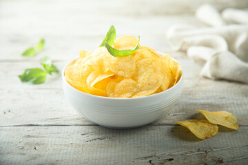 Potato chips in a white bowl