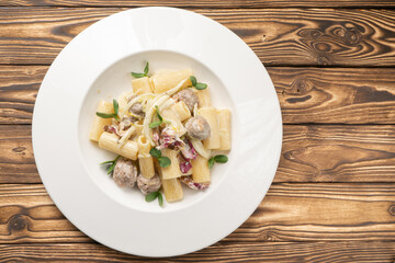 Rigatoni pasta with meatballs and bechamel sauce