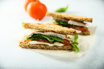 Chicken sandwich with tomato and cheese