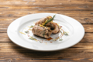 Chicken fillet rolls with rosemary in orange sauce