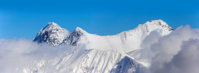 Caucasus mountains, Kardyvach peak, sun, snow and blue sky