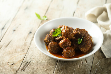 Traditional homemade meatballs with fresh basil