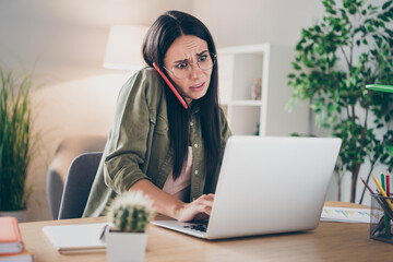 Photo of young attractive lovely pretty unhappy upset sad woman in glasses talk phone working in...