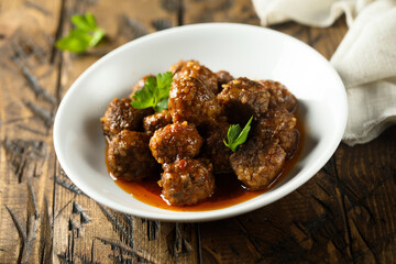 Traditional homemade meatballs with fresh basil