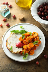 Homemade roasted pork with carrot and gooseberry sauce