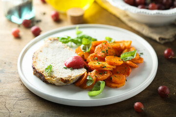 Homemade roasted pork with carrot and gooseberry sauce