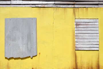 Banner of background of old dirty yellow wall with gray tiles put for text