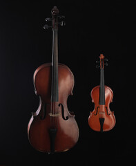 Fototapeta na wymiar cello and violin on a black background