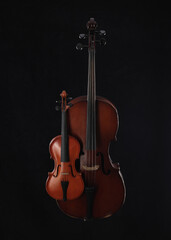 Fototapeta na wymiar silhouette of cello and violin on black background