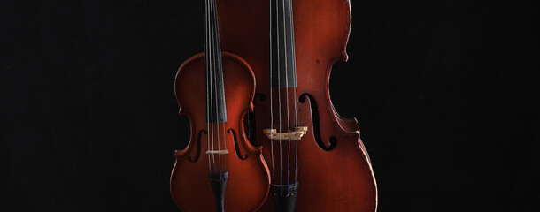 cello and violin on a black background