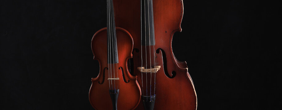 cello and violin on a black background