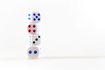 Stack of mlticolored gambling dices isolated on the white background