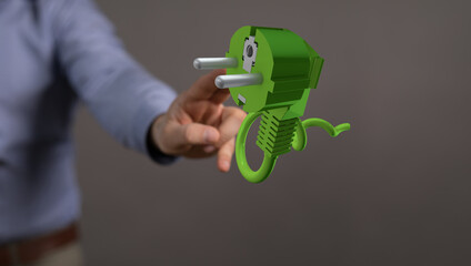 green power plug in hand