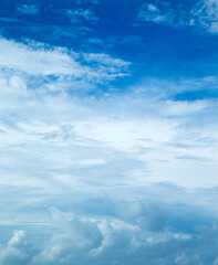 blue sky background with tiny clouds