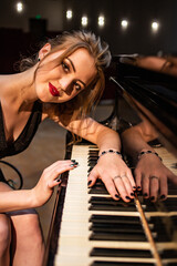 Fototapeta na wymiar young woman playing piano