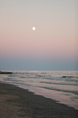 Full moon over the evening sea