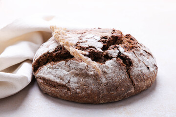 Homemade rye bread, sprinkled with flour,