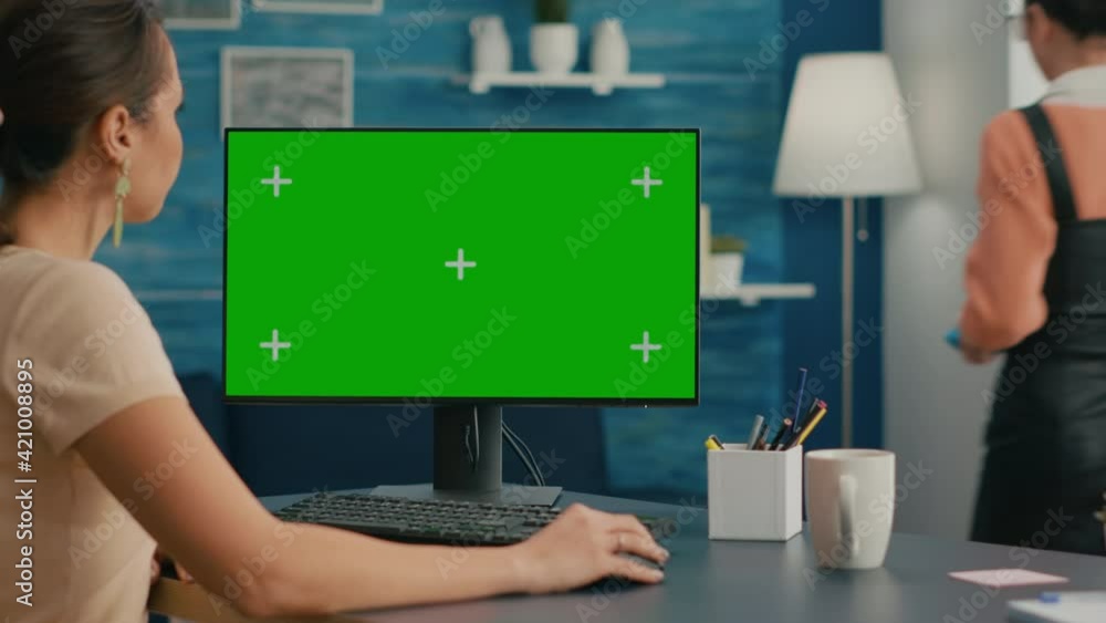 Poster woman looking at computer with green screen mock up chroma key display working at business commerce,
