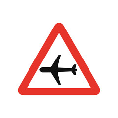 Obraz premium Triangular traffic signal in white and red, isolated on white background. Warning of low flying aircrafts