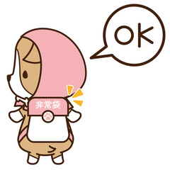 防災頭巾を被って非常袋を持った準備の良い犬のコーギー