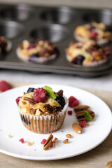 mixed berry low carb Keto Diet muffin with almond and nut. set on cafe table.