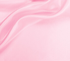 Smooth elegant pink silk or satin texture as wedding background. Luxurious background design
