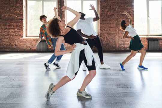 Beautiful young lady during dancing classes in studio