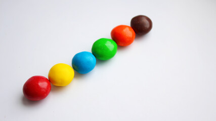 Colorful chocolate candy treat on white isolated background. ММ