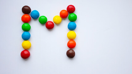 Colorful chocolate candy treat on white isolated background. ММ