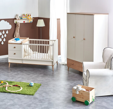 Baby room design furniture style with bed cabinet and dresser, decorative child room with lamp hanger and sofa style.