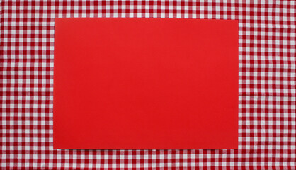 Colored background. Red checkered tablecloth and red background. 