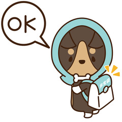 防災頭巾を被って非常袋を持った準備の良い犬のコーギー